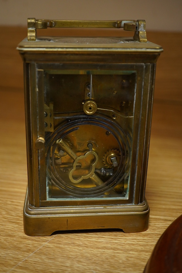 A brass bulk head timepiece and a late 19th century brass cased carriage clock, the dial inscribed Mallory Bath, made in Paris, with key